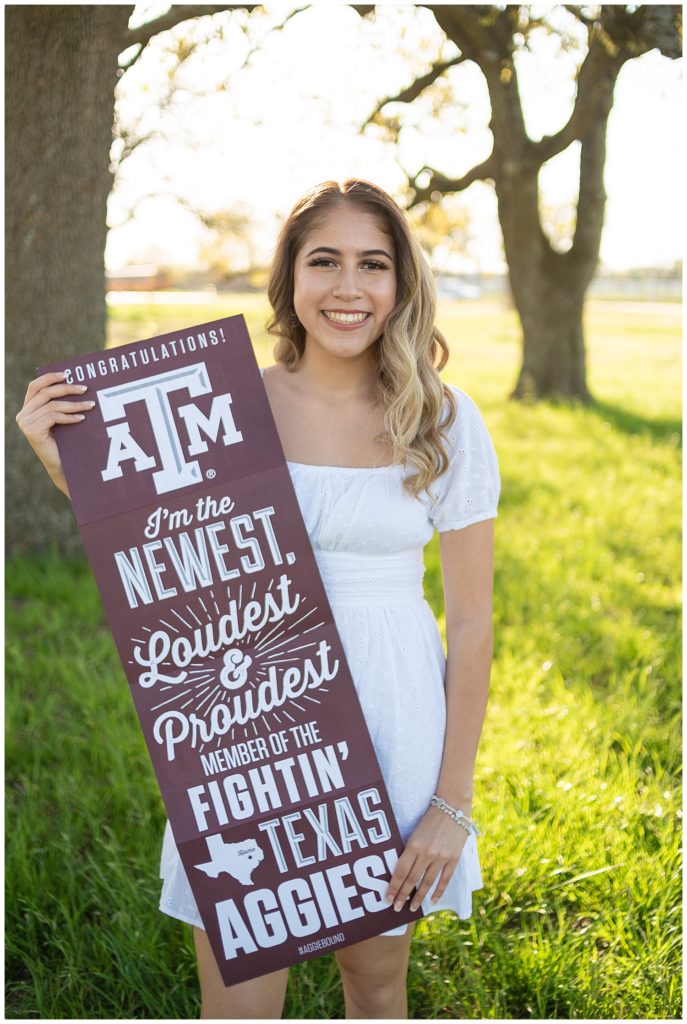 College Announcement photo with the TAMU newest member sign.