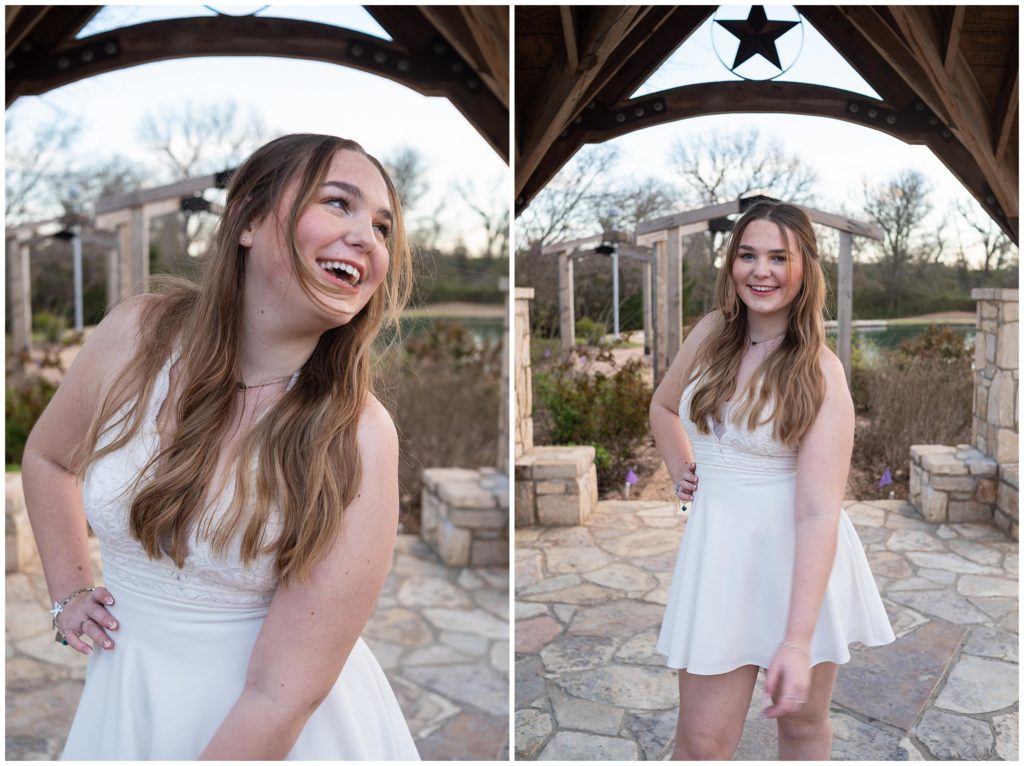 Girl smiling in a white dress under a pavilion at the Bush Library. 