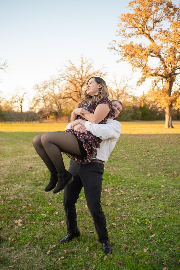 guy surprise hugging his fiance and lifting her in the air